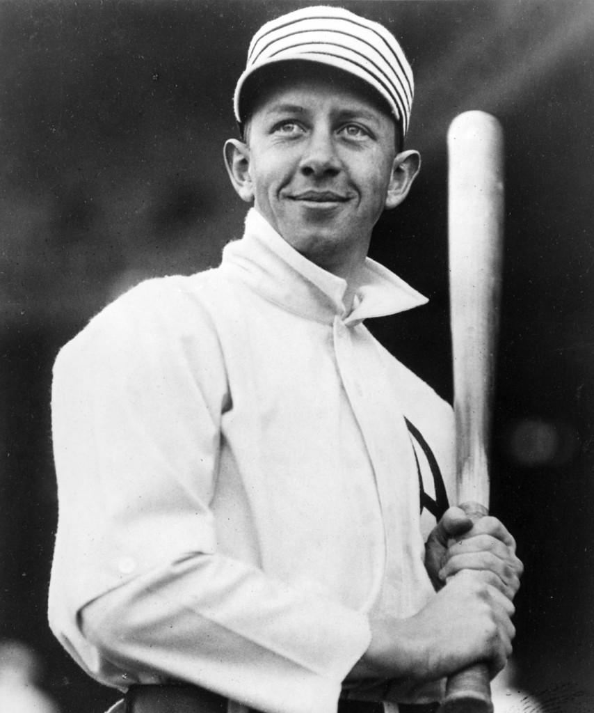 A baseball player holding a bat in his hands.