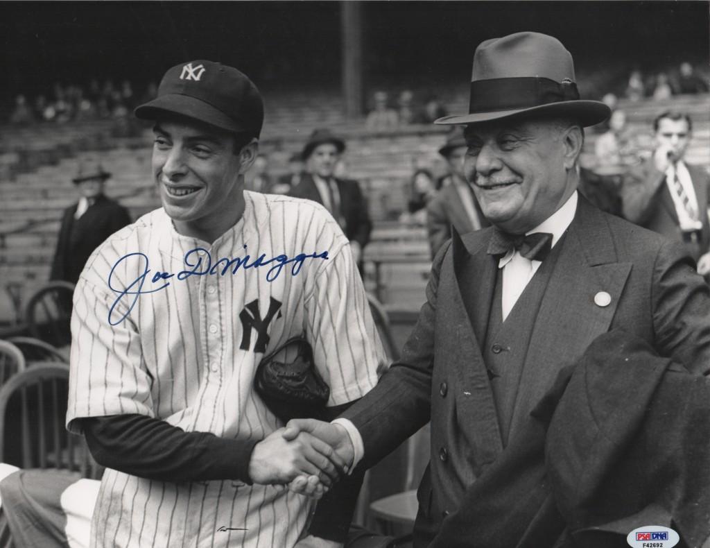 Joe DiMaggio shakes hands with the Yankee owner Jacob Ruppert