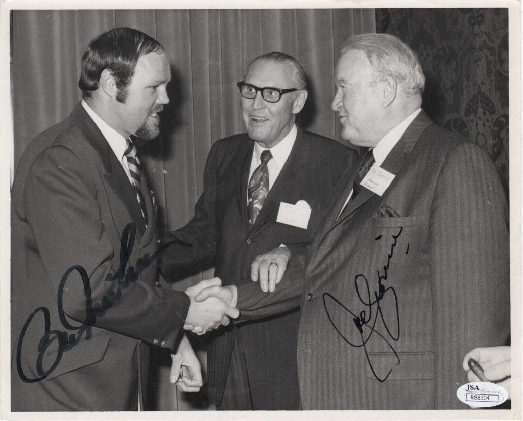 AL chief Joe Cronin shakes hands with 11-time All Star Bill Freehan, both have signed this photo