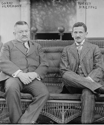 Reds owner Gary Herrmann sits with the Pirates Barney Dreyfuss