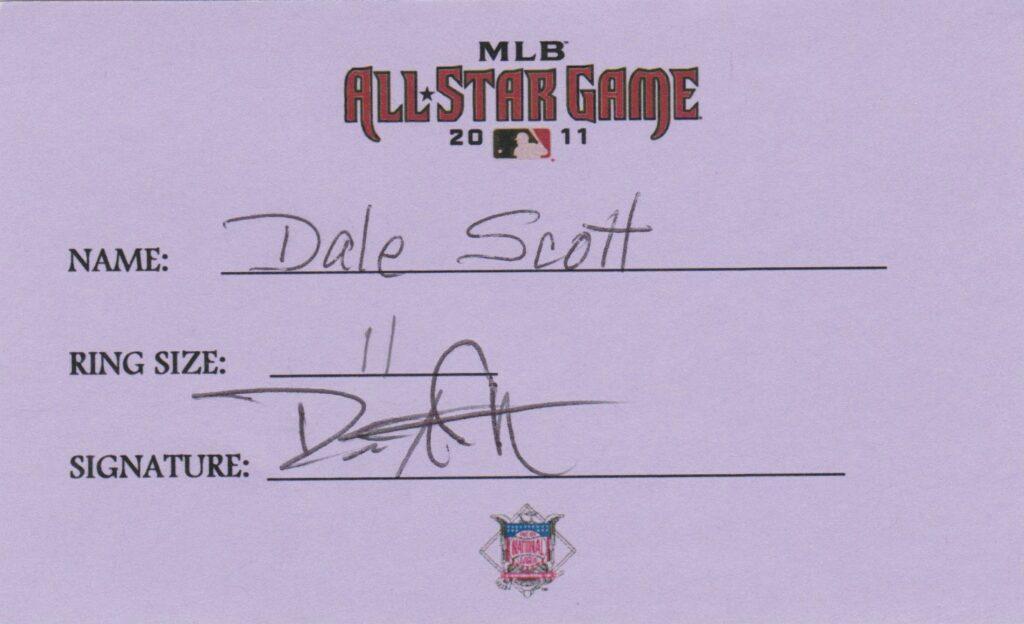 Dale Scott called balls and strikes in the 2011 All Star game; here he signs for his All Star ring