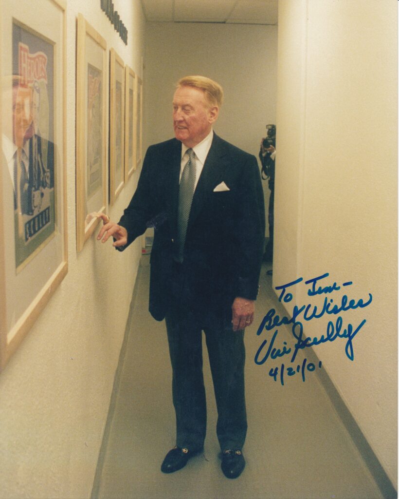 Scully walks down the press box 